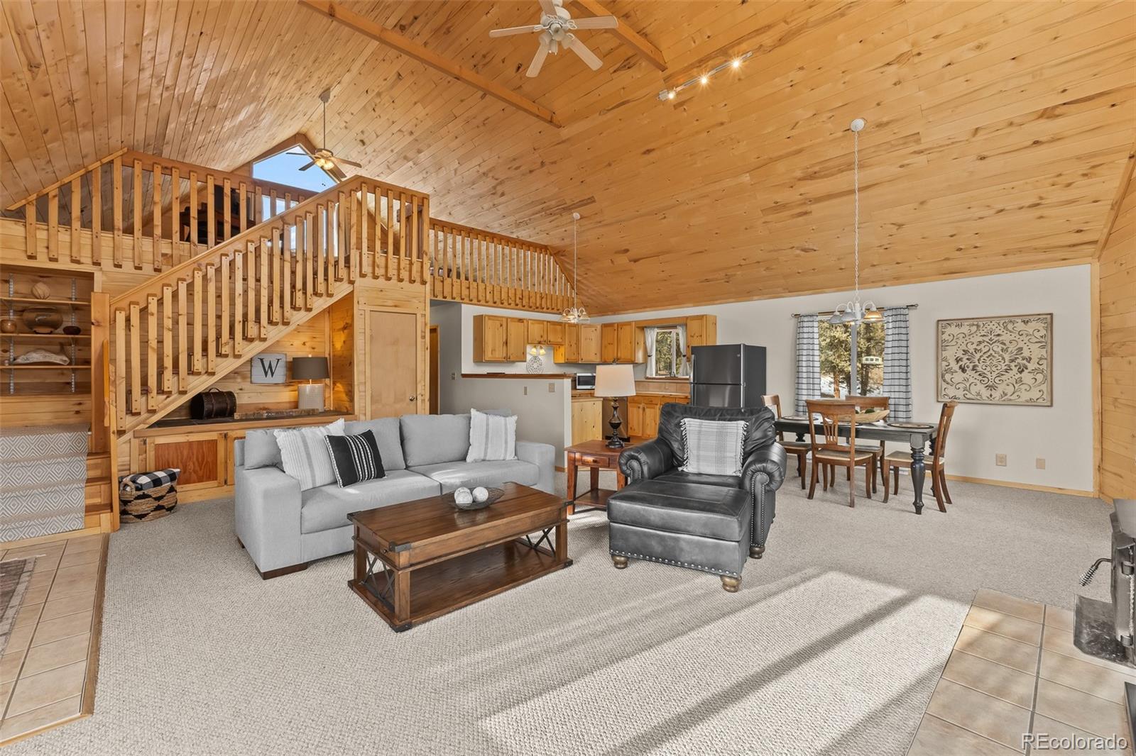 4018 Arrowhead Drive Como, CO 80456 - Photo 16 of 50 a living room with furniture and a table