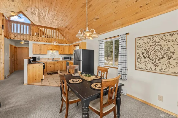 a kitchen with a sink appliances and cabinets