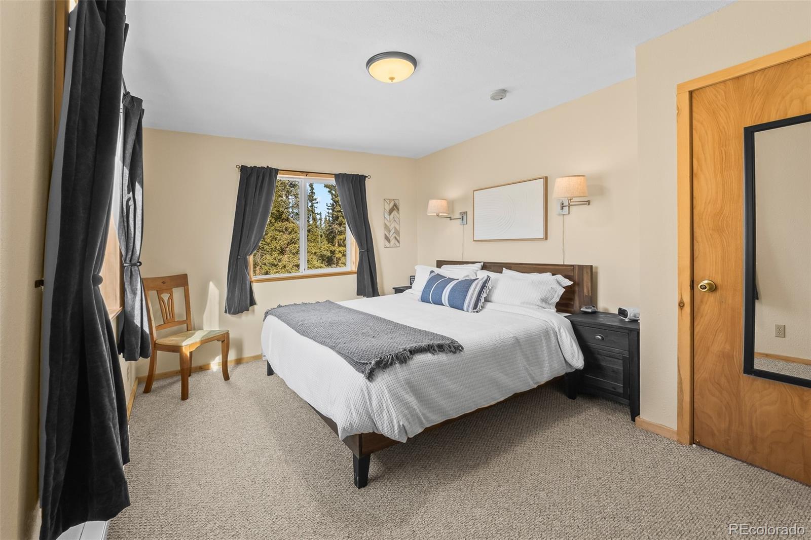 4018 Arrowhead Drive Como, CO 80456 - Photo 31 of 50 a spacious bedroom with a bed and a window