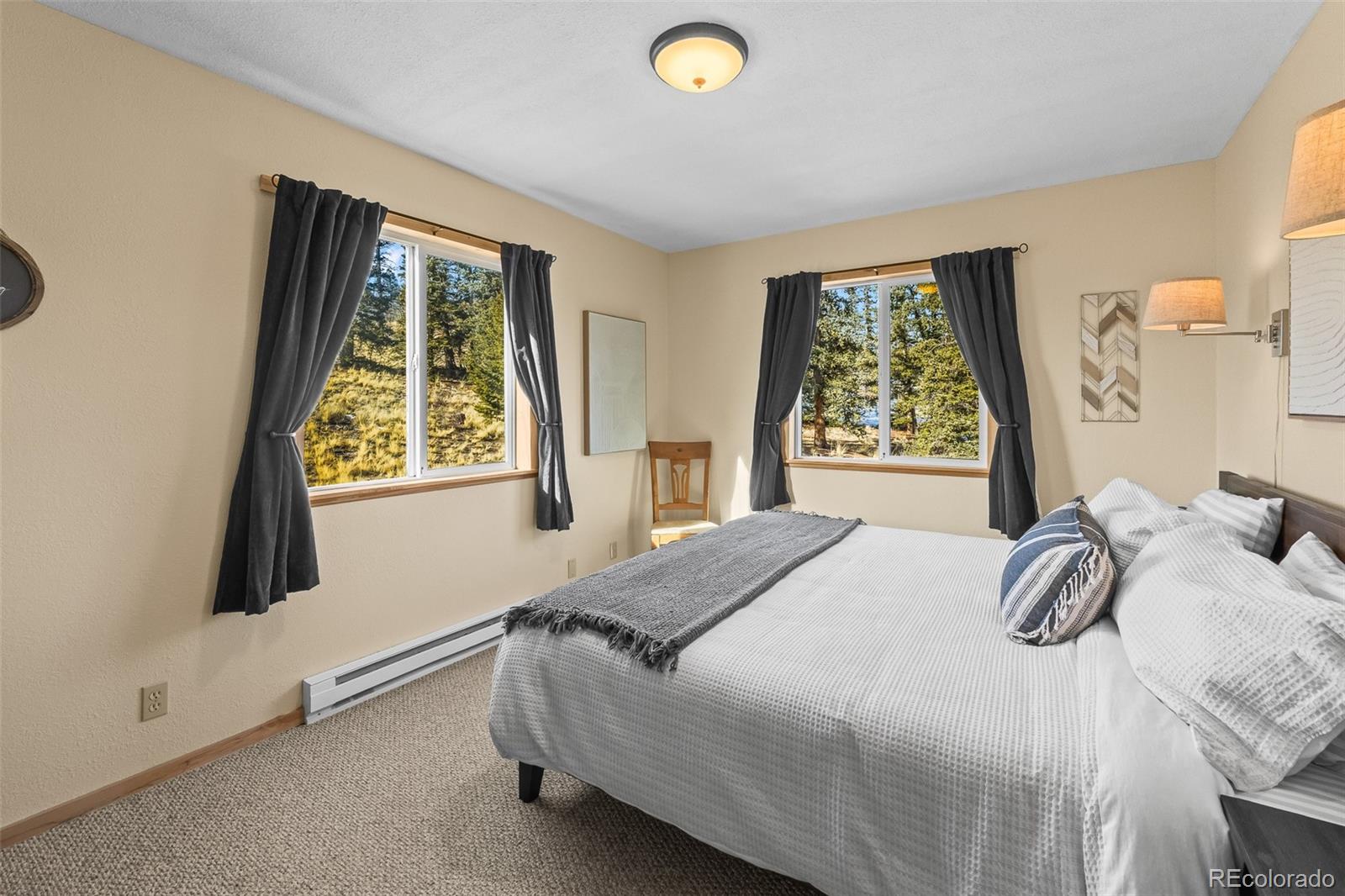 4018 Arrowhead Drive Como, CO 80456 - Photo 32 of 50 a bedroom with a bed and a window