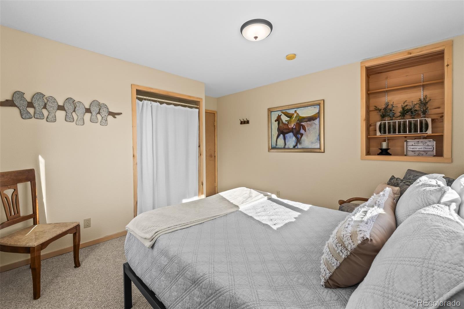 4018 Arrowhead Drive Como, CO 80456 - Photo 36 of 50 a bedroom with a bed and a painting on the wall