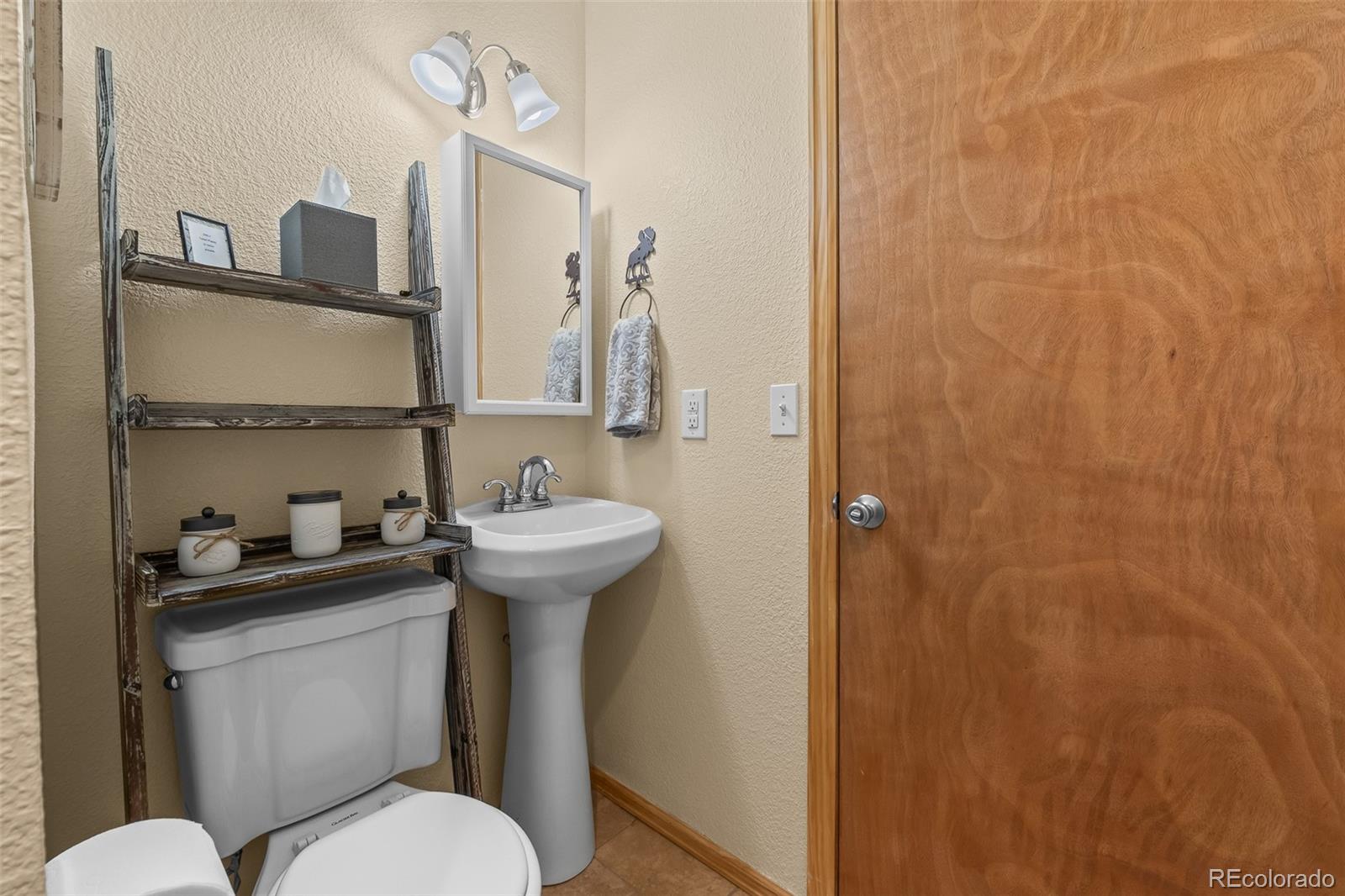 4018 Arrowhead Drive Como, CO 80456 - Photo 45 of 50 a bathroom with a sink a toilet and shower