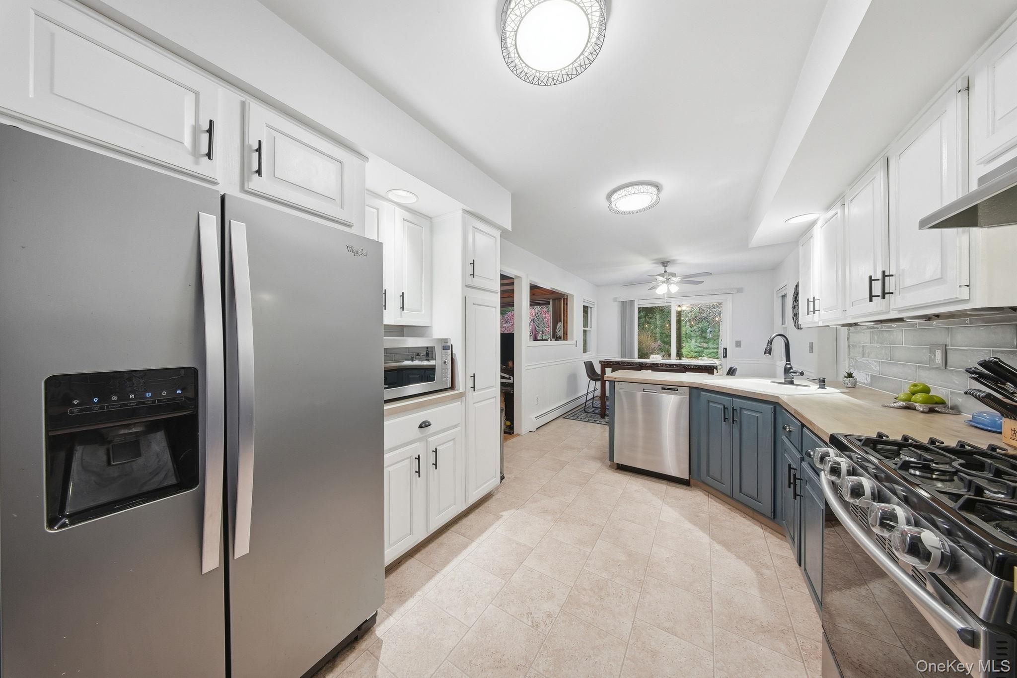44 Florio Earl Road Wurtsboro, NY 12790 - Photo 15 of 42 a kitchen with stainless steel appliances a refrigerator sink and stove