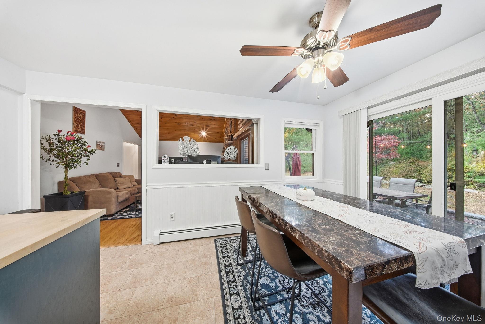 44 Florio Earl Road Wurtsboro, NY 12790 - Photo 18 of 42 a living room with granite countertop furniture and a large window