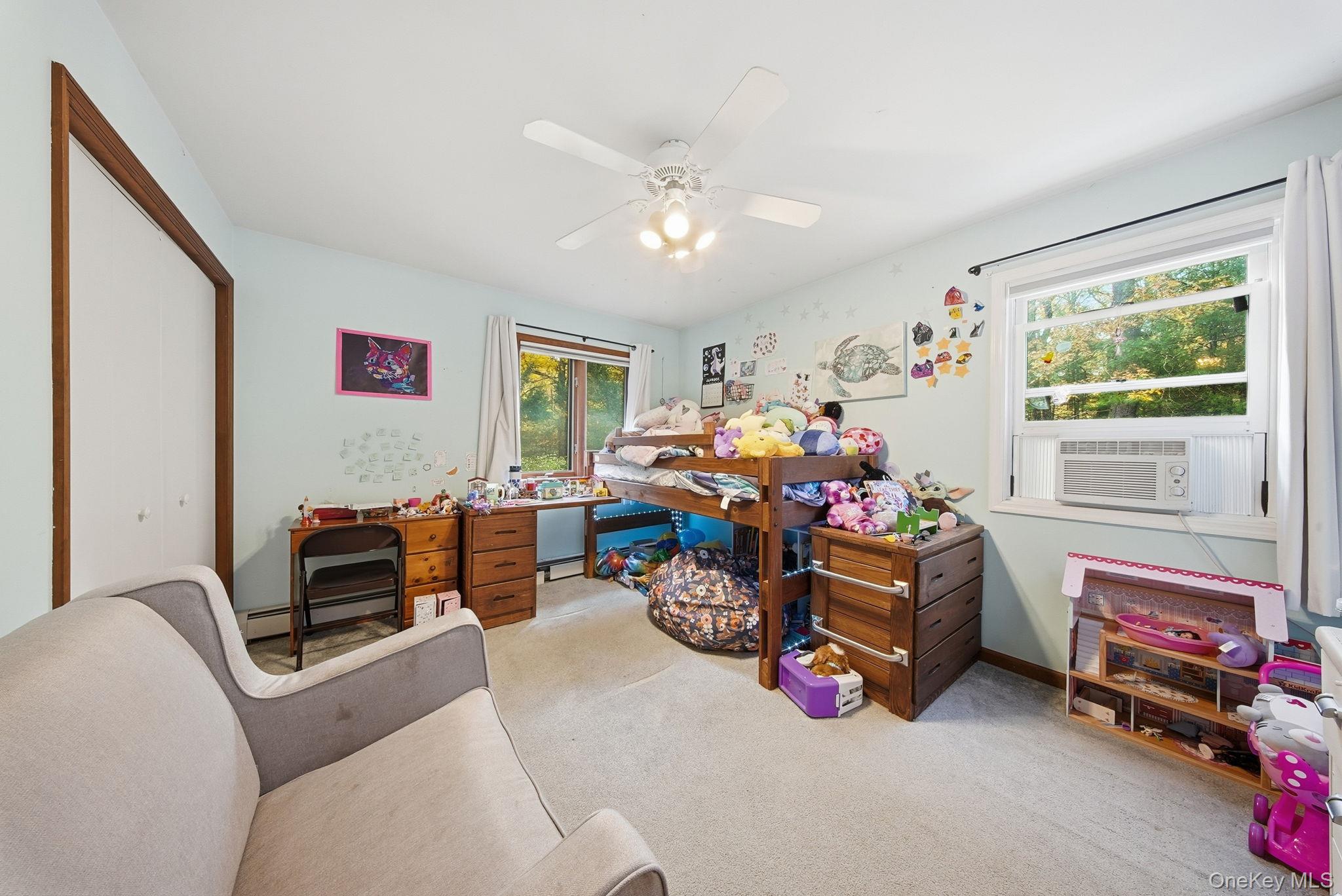 44 Florio Earl Road Wurtsboro, NY 12790 - Photo 23 of 42 a bedroom with furniture and a window