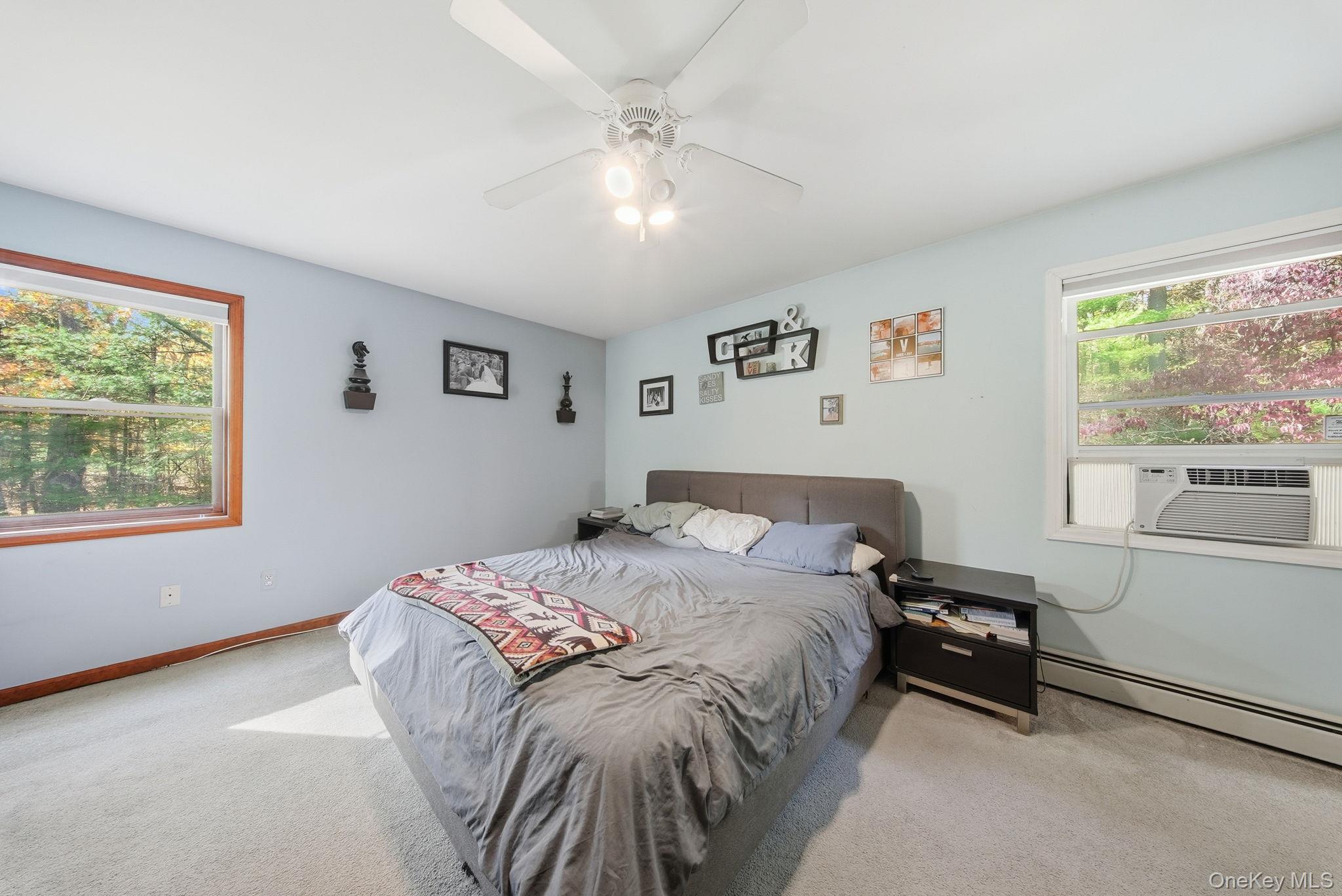 44 Florio Earl Road Wurtsboro, NY 12790 - Photo 24 of 42 a bedroom with a bed and a window