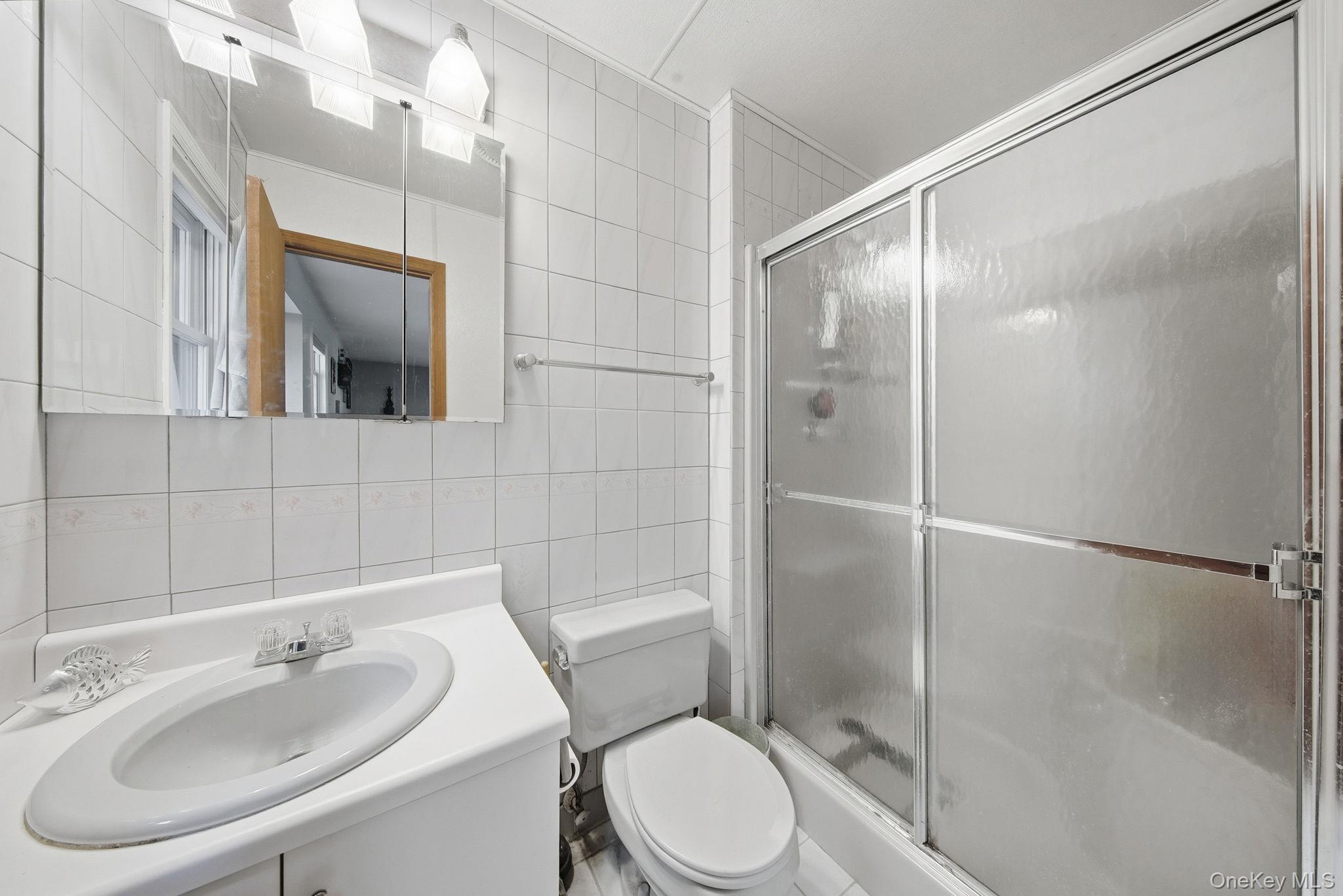 44 Florio Earl Road Wurtsboro, NY 12790 - Photo 26 of 42 a bathroom with a sink toilet and shower