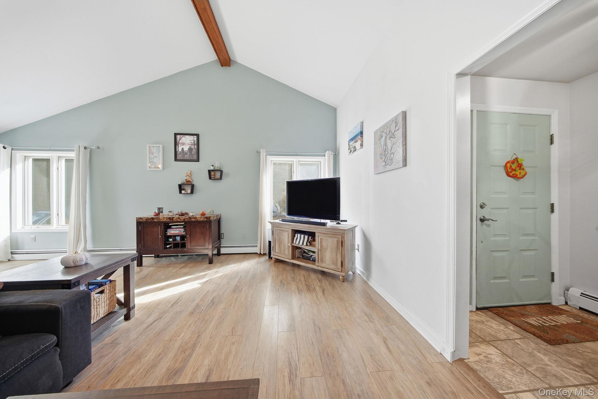 44 Florio Earl Road Wurtsboro, NY 12790 - Photo 9 of 42 a living room with furniture and a flat screen tv