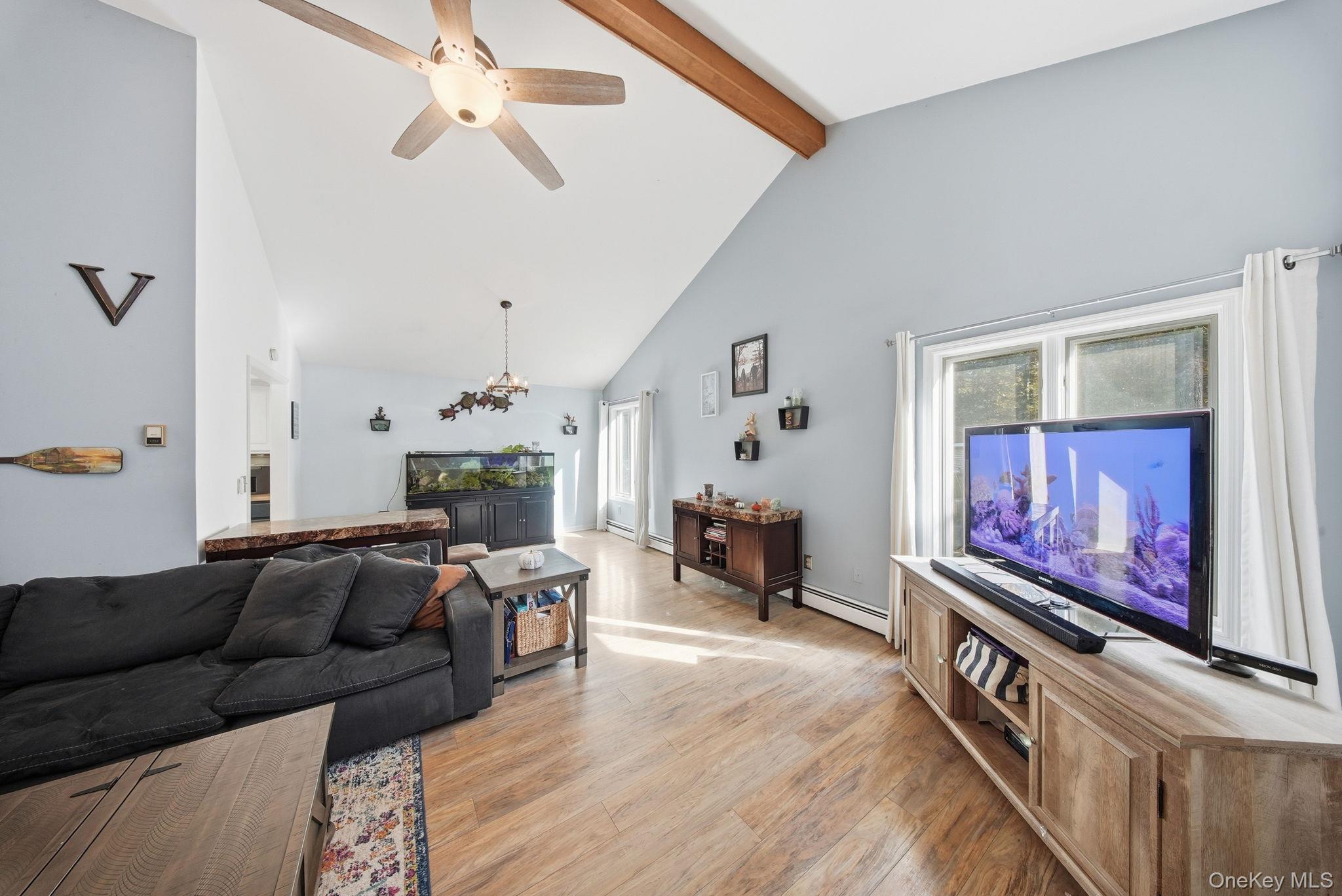 44 Florio Earl Road Wurtsboro, NY 12790 - Photo 10 of 42 a living room with furniture and a flat screen tv