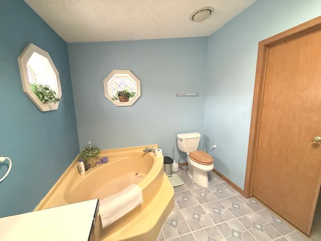 a bathroom with a toilet and a sink