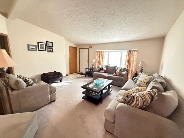 a living room with furniture window and a couch