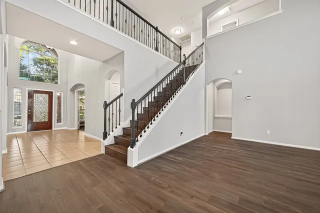 a view of an entryway with wooden floor