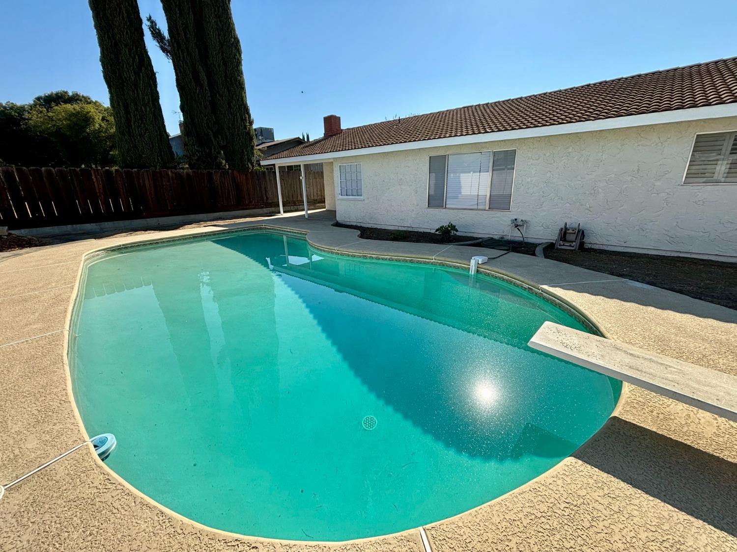 910 Cedar Lane Lemoore, CA 93245 - Photo 11 of 32 a view of a house with a backyard