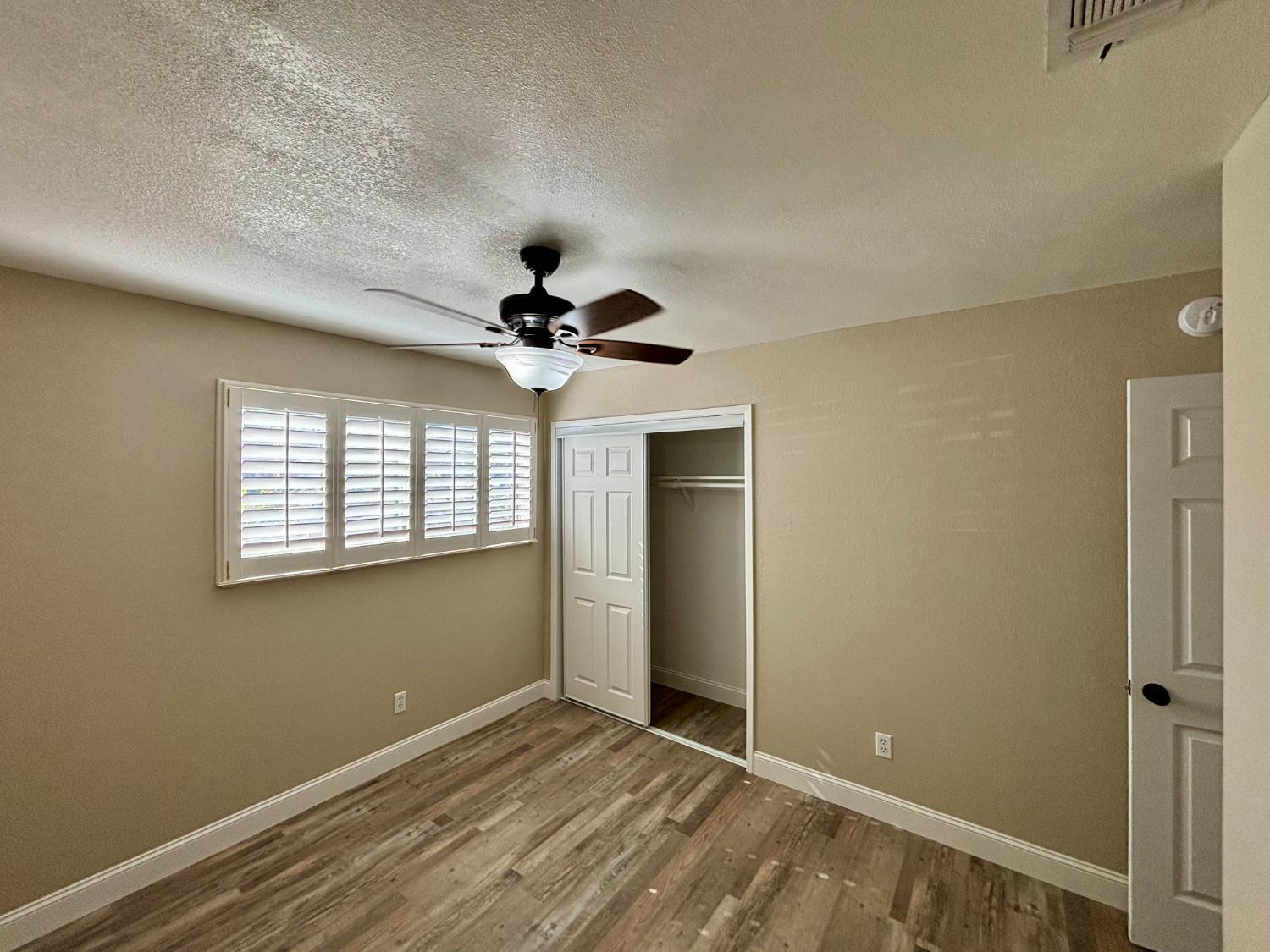 910 Cedar Lane Lemoore, CA 93245 - Photo 27 of 32 a view of an empty room with a window