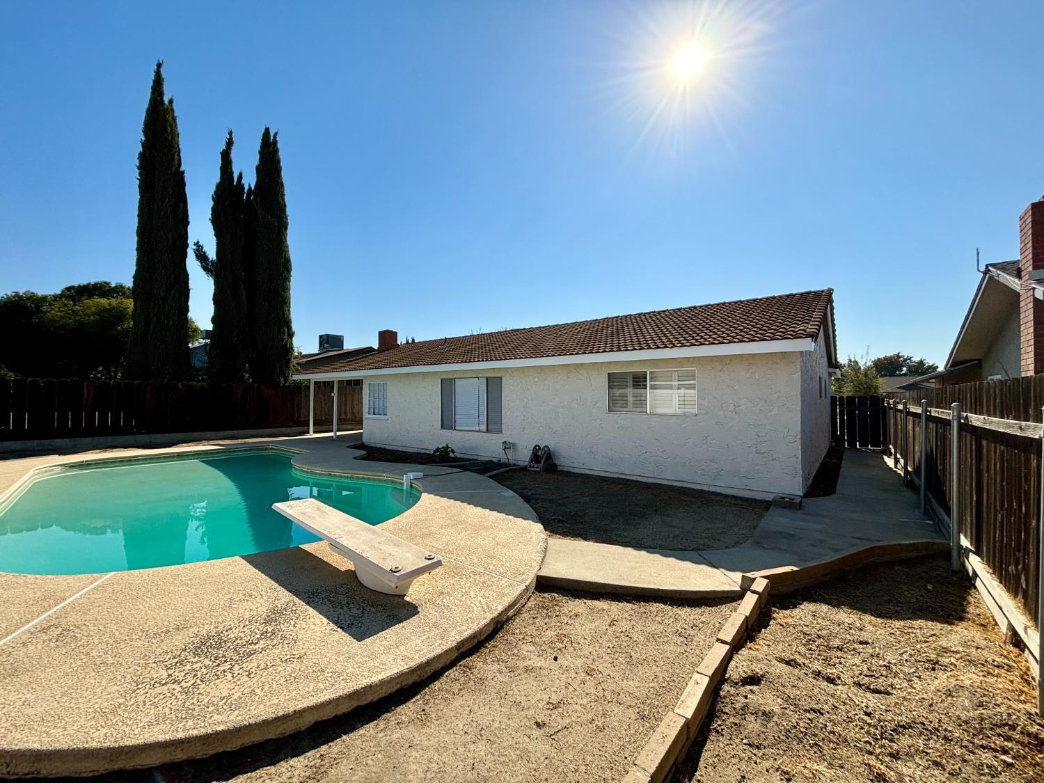 910 Cedar Lane Lemoore, CA 93245 - Photo 7 of 32 a view of a backyard with sitting area