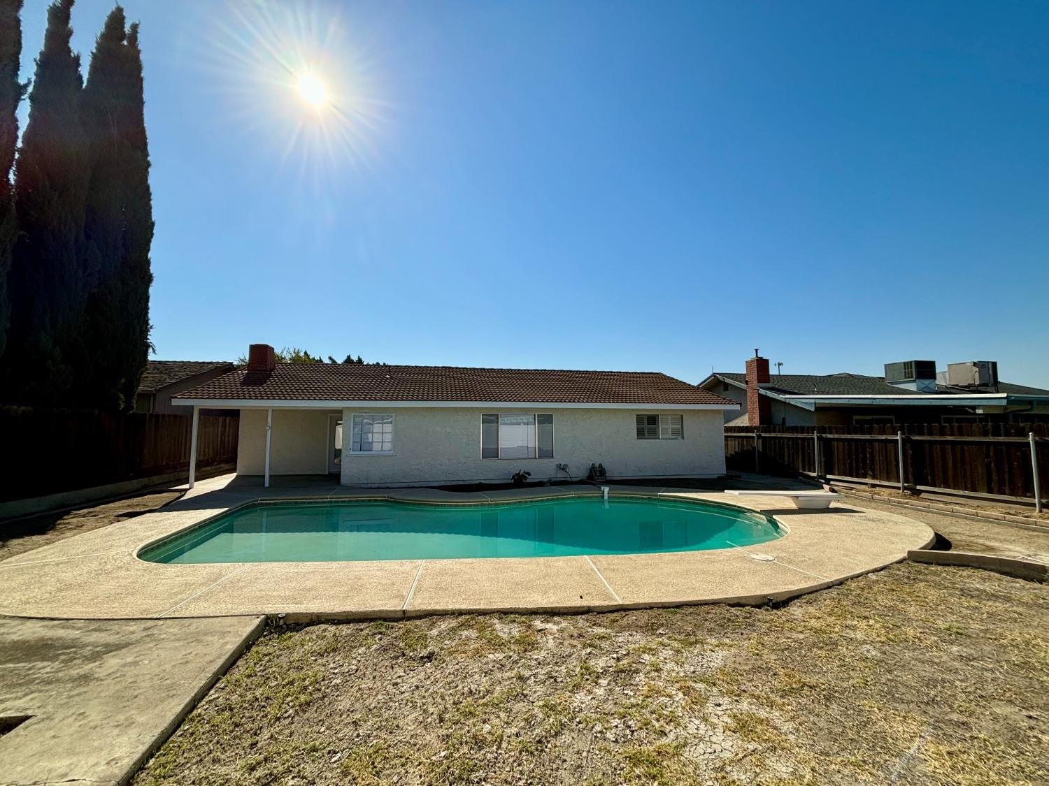 910 Cedar Lane Lemoore, CA 93245 - Photo 9 of 32 a view of house with outdoor space and sitting area