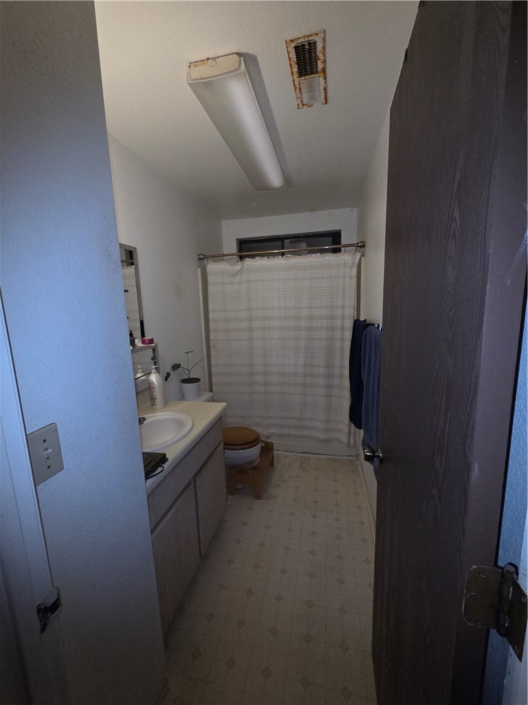 633 North Street Corning, CA 96021 - Photo 16 of 26 a bathroom with a sink toilet and shower