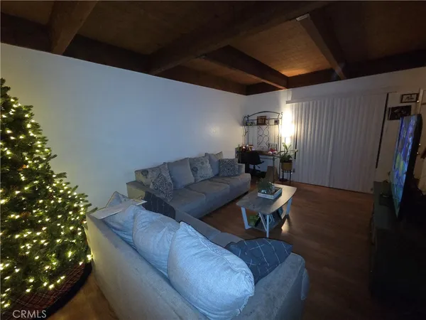 a living room with furniture and flowers