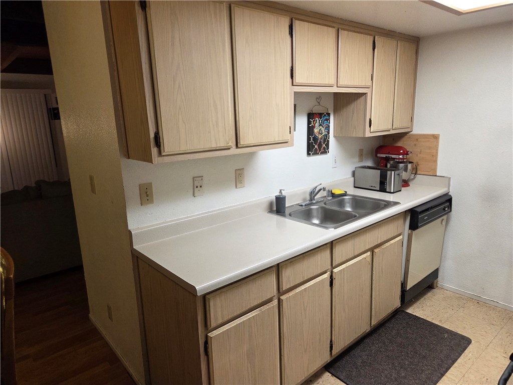 633 North Street Corning, CA 96021 - Photo 10 of 26 a kitchen with stainless steel appliances granite countertop a sink stove and cabinets