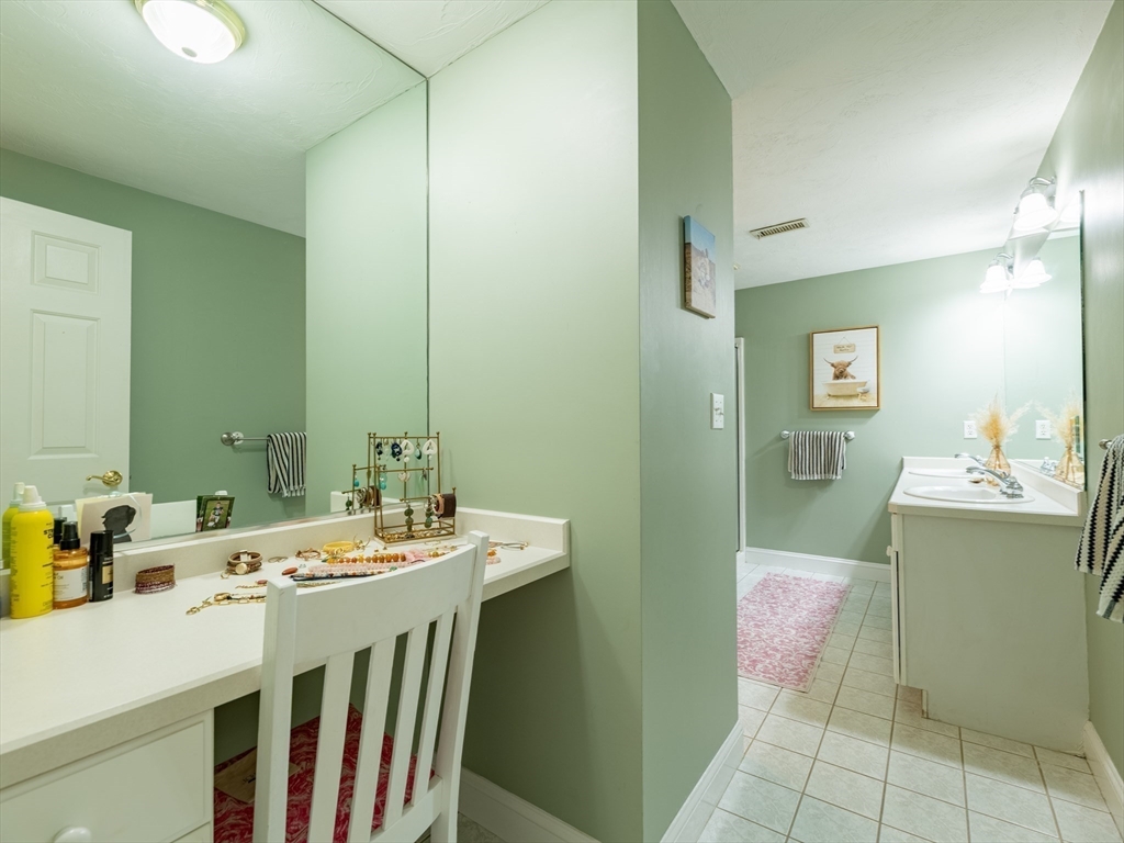 67 Tussock Brook Road, Unit 67 Duxbury, MA 02332 - Photo 20 of 39 a bathroom with a sink double vanity and a mirror