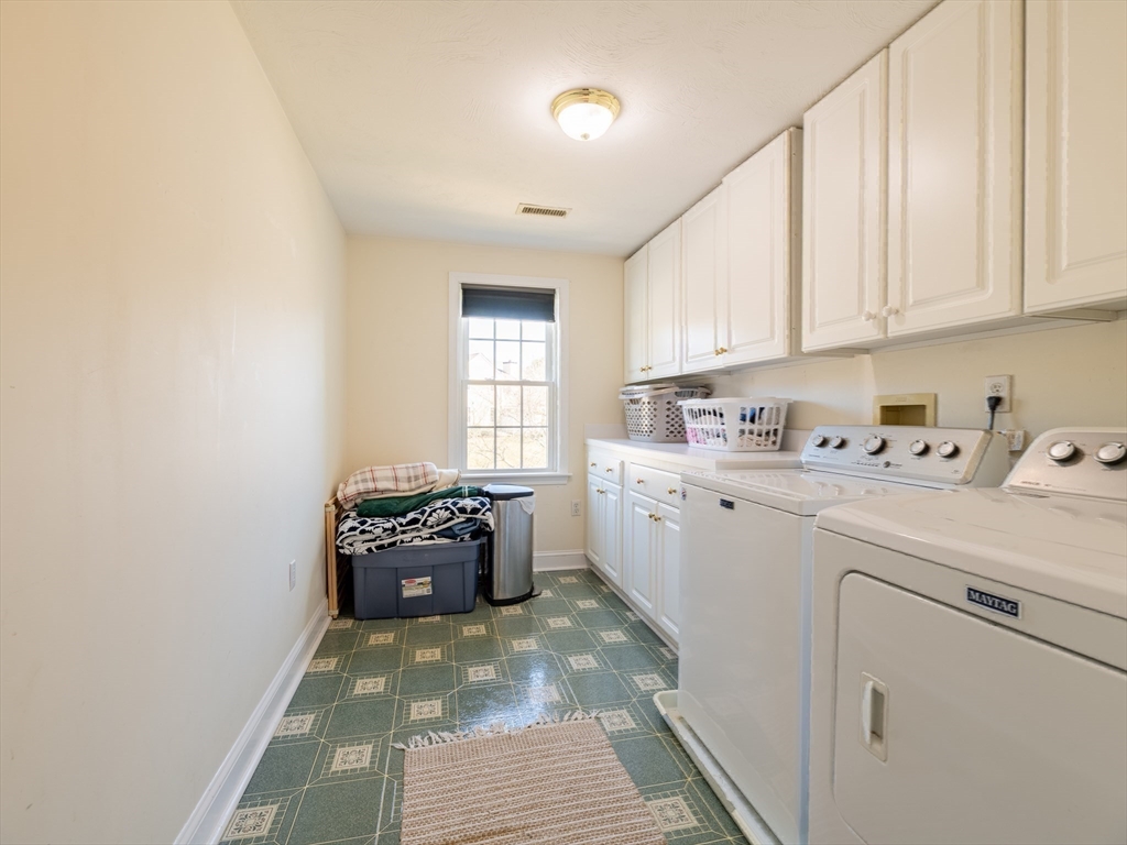 67 Tussock Brook Road, Unit 67 Duxbury, MA 02332 - Photo 24 of 39 a kitchen with a sink cabinets and window