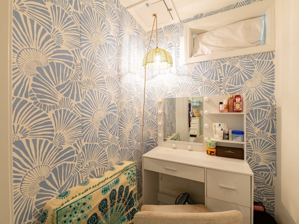 67 Tussock Brook Road, Unit 67 Duxbury, MA 02332 - Photo 28 of 39 a bathroom with a sink and a mirror