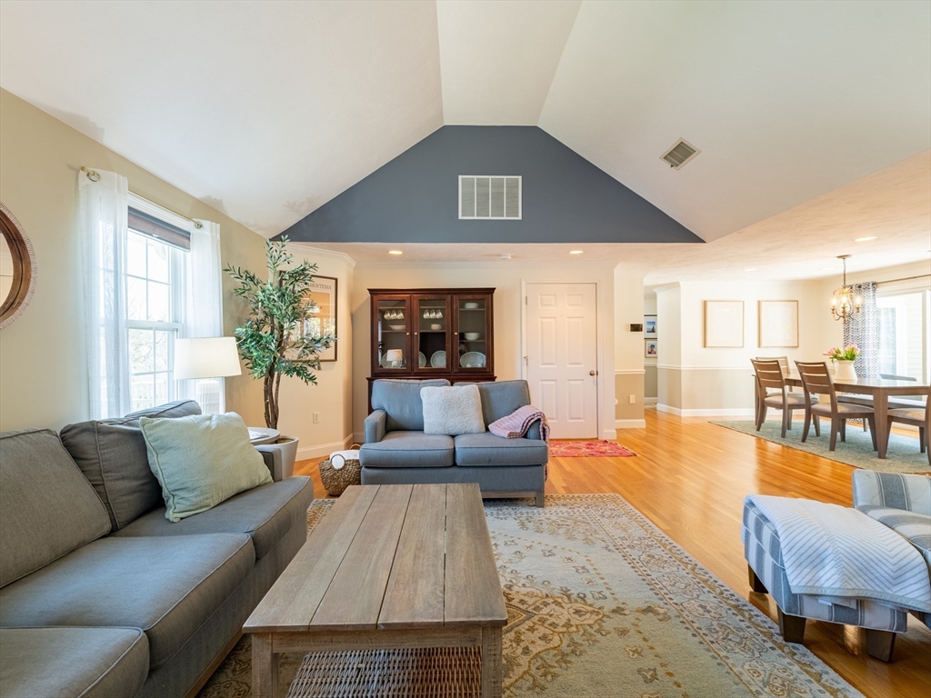 67 Tussock Brook Road, Unit 67 Duxbury, MA 02332 - Photo 3 of 39 a living room with furniture and a large window