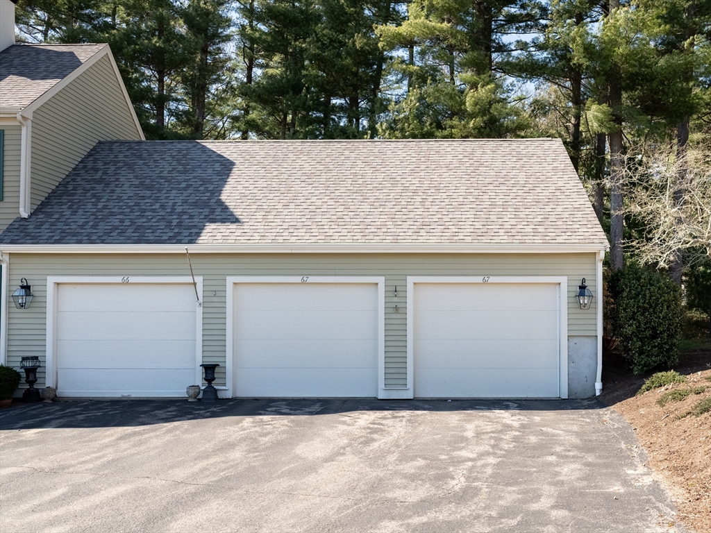 67 Tussock Brook Road, Unit 67 Duxbury, MA 02332 - Photo 35 of 39 a view of a garage
