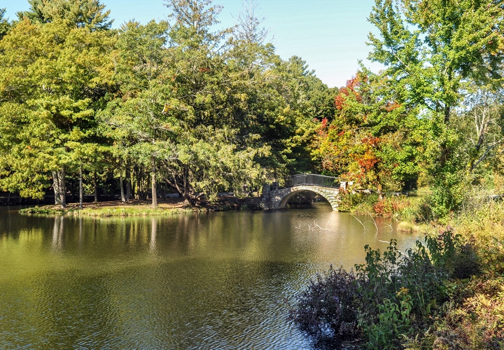 67 Tussock Brook Road, Unit 67 Duxbury, MA 02332 - Photo 37 of 39 a view of a lake with houses