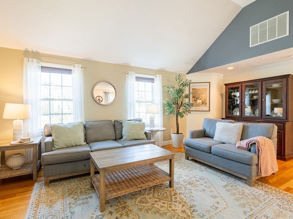 67 Tussock Brook Road, Unit 67 Duxbury, MA 02332 - Photo 6 of 39 a living room with furniture and a large window