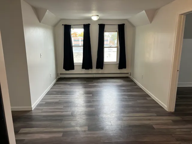wooden floor in an empty room with windows