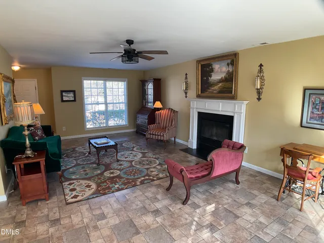 a dining room with furniture and chandelier