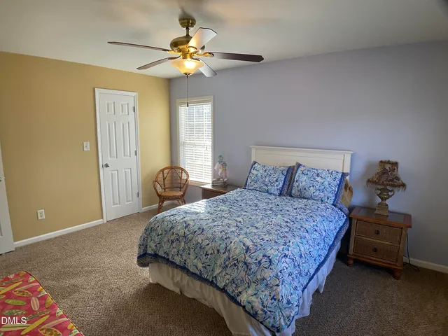 a view of a bathroom with a sink and mirror