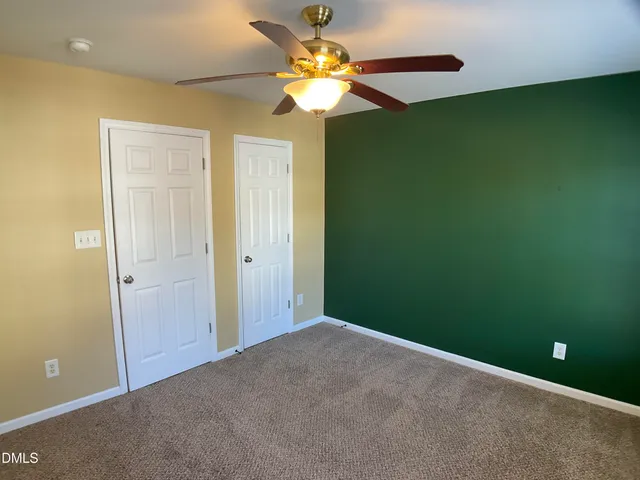 a bathroom with a granite countertop toilet a sink and bathtub