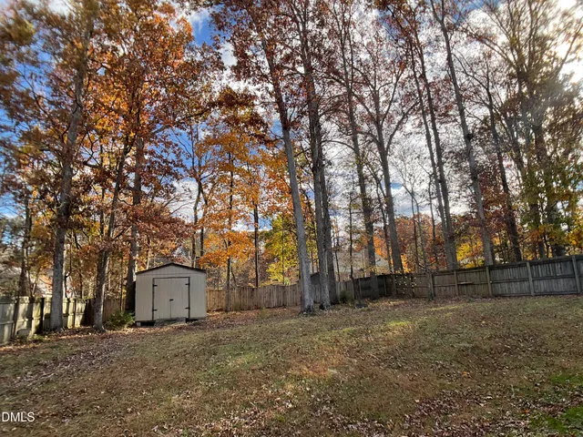 a view of room with window and ceiling fan