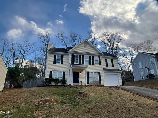 a view of a chairs and table in backyard