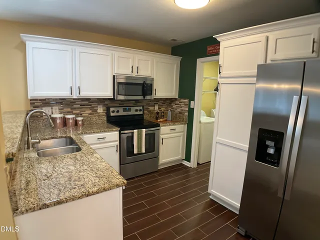 a living room with furniture fireplace and window