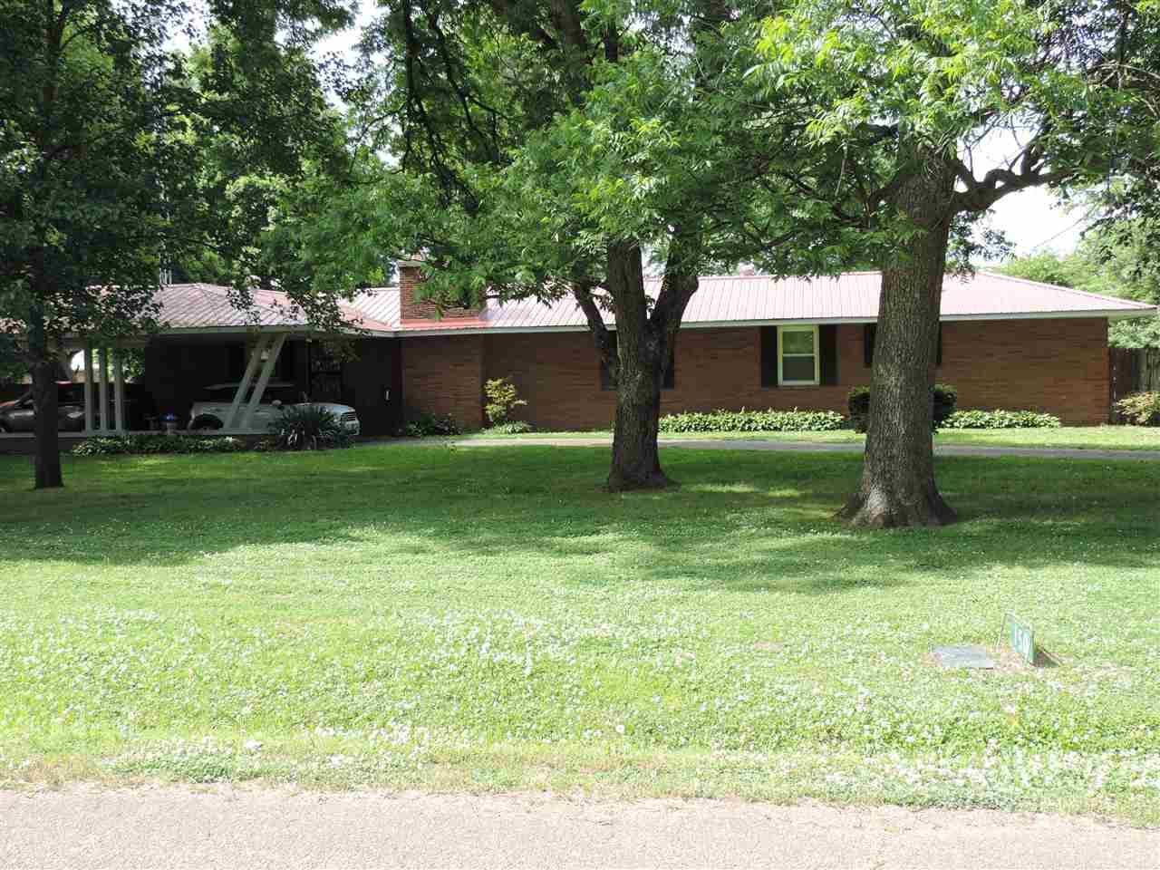 150 Tatum Street Ridgely, TN 38080 - Photo 1 of 17 a view of a tree in front of a house