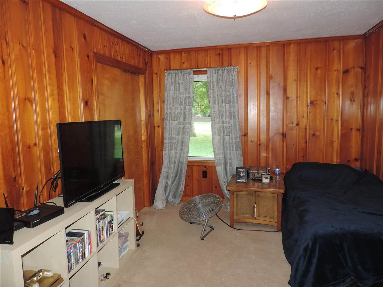 150 Tatum Street Ridgely, TN 38080 - Photo 11 of 17 a room with furniture and flat screen tv