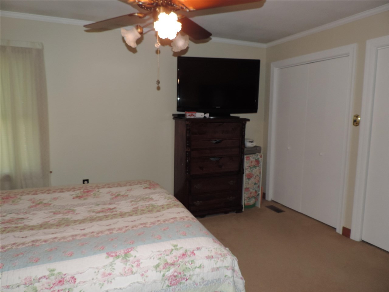 150 Tatum Street Ridgely, TN 38080 - Photo 14 of 17 a bed room with a bed and a television