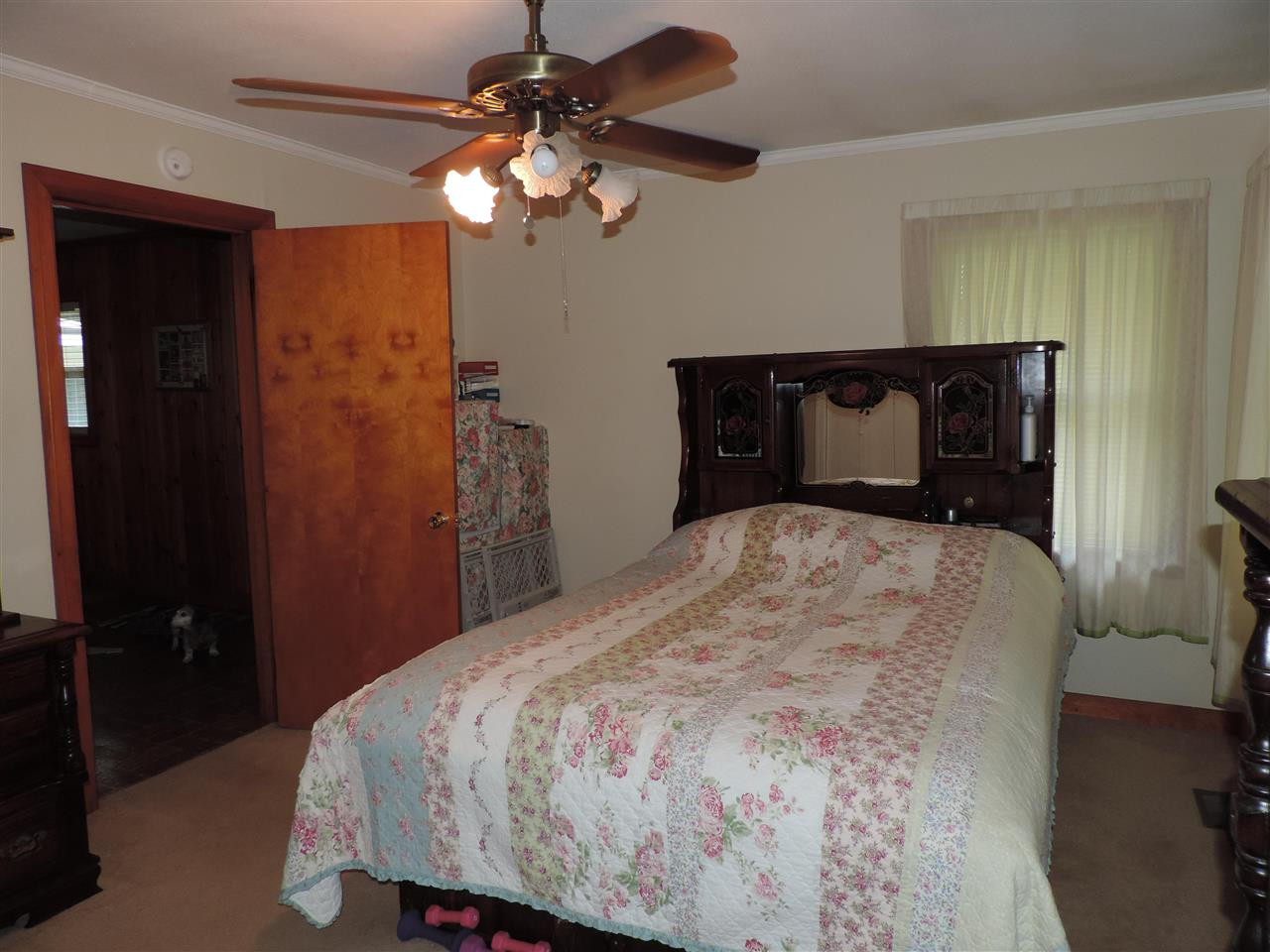 150 Tatum Street Ridgely, TN 38080 - Photo 15 of 17 a bedroom with a bed and a chandelier