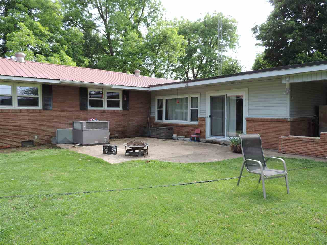 150 Tatum Street Ridgely, TN 38080 - Photo 16 of 17 a backyard of a house with table and chairs