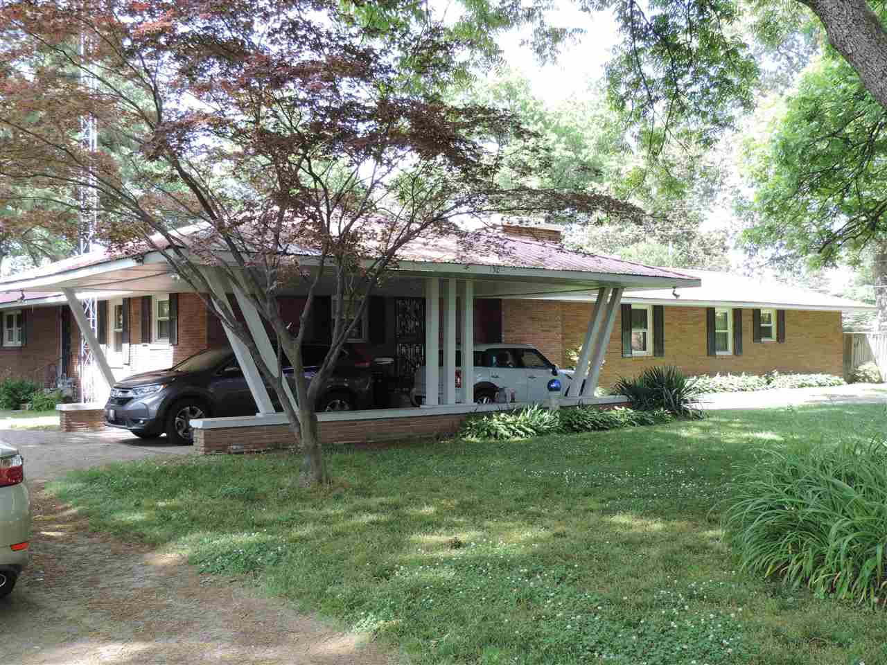 150 Tatum Street Ridgely, TN 38080 - Photo 2 of 17 a view of a house with a yard and sitting area