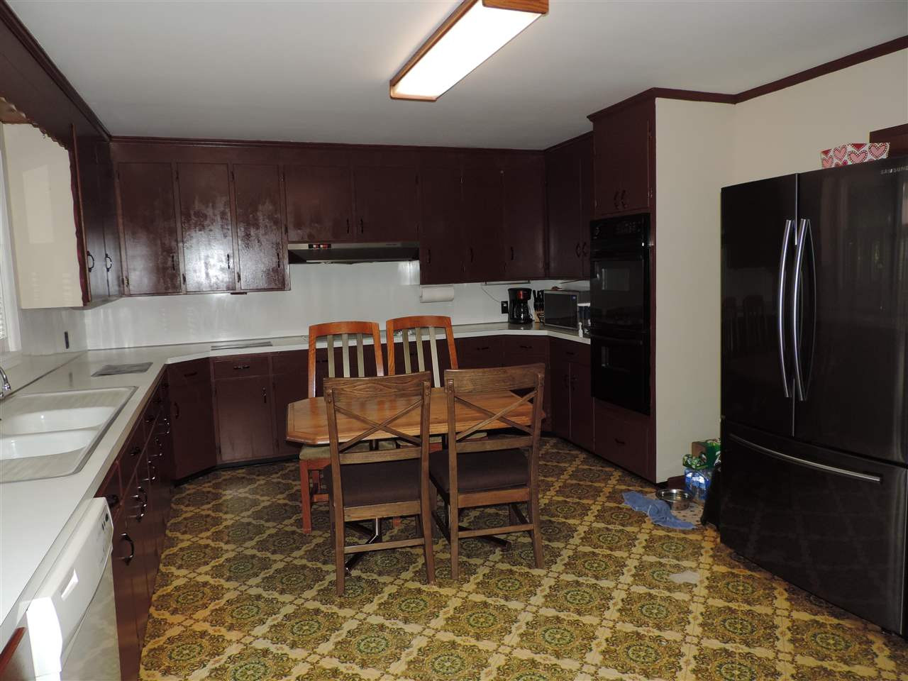 150 Tatum Street Ridgely, TN 38080 - Photo 3 of 17 a kitchen with stainless steel appliances a stove a sink and a refrigerator