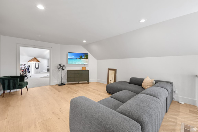 180 Farm Road Midway, UT 84049 - Photo 51 of 99 Bright attic space featuring light wood-finish flooring, recessed lighting, and a white painted vaulted ceiling