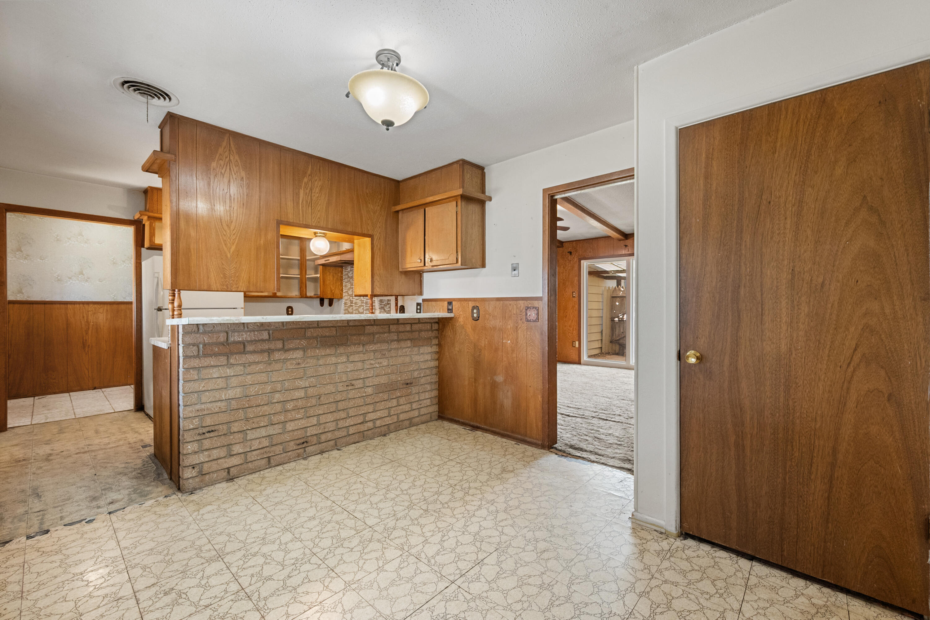 5440 48th Street Lubbock, TX 79414 - Photo 12 of 28 a room with a cabinets and a dresser