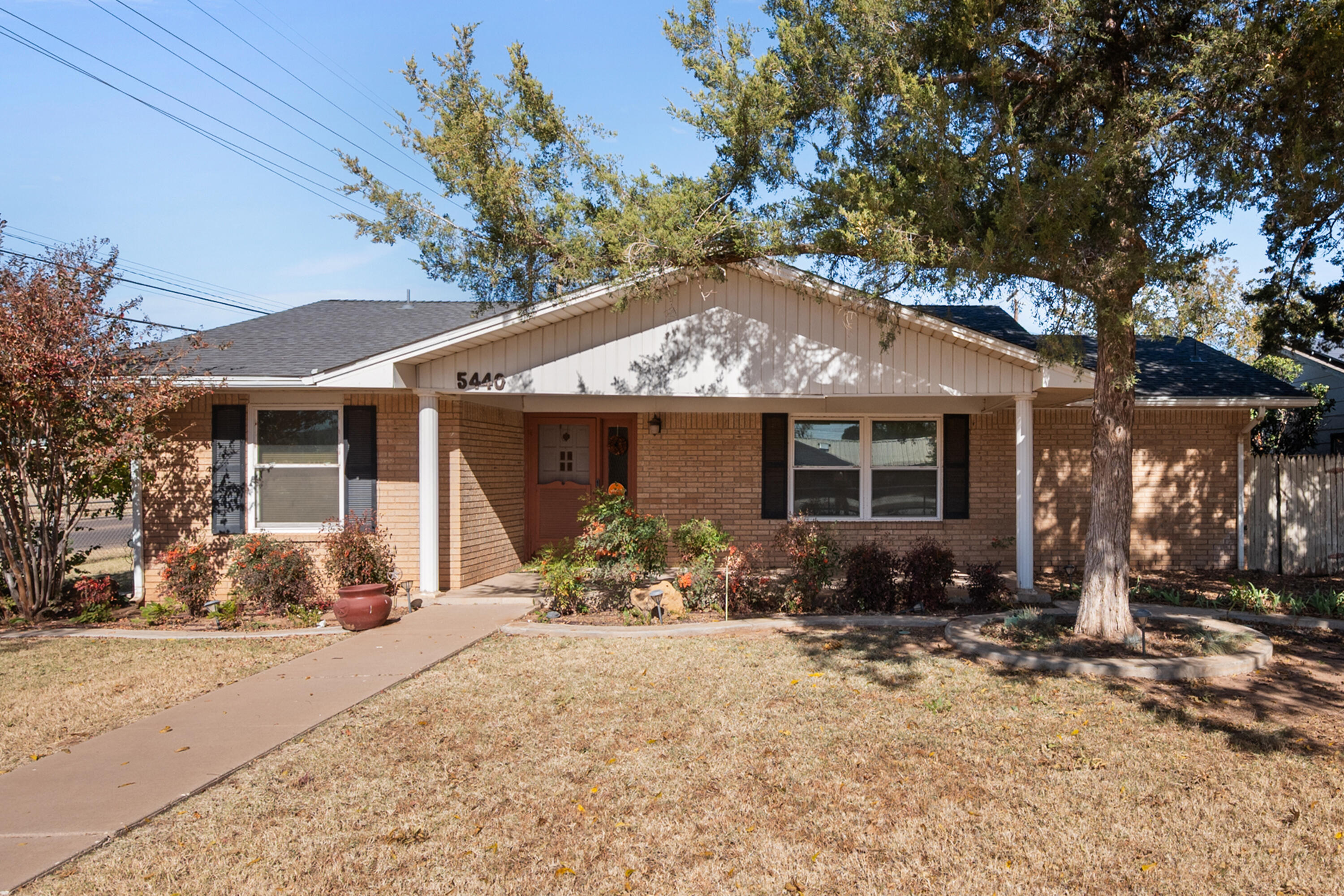 5440 48th Street Lubbock, TX 79414 - Photo 2 of 28 a front view of a house with outdoor seating