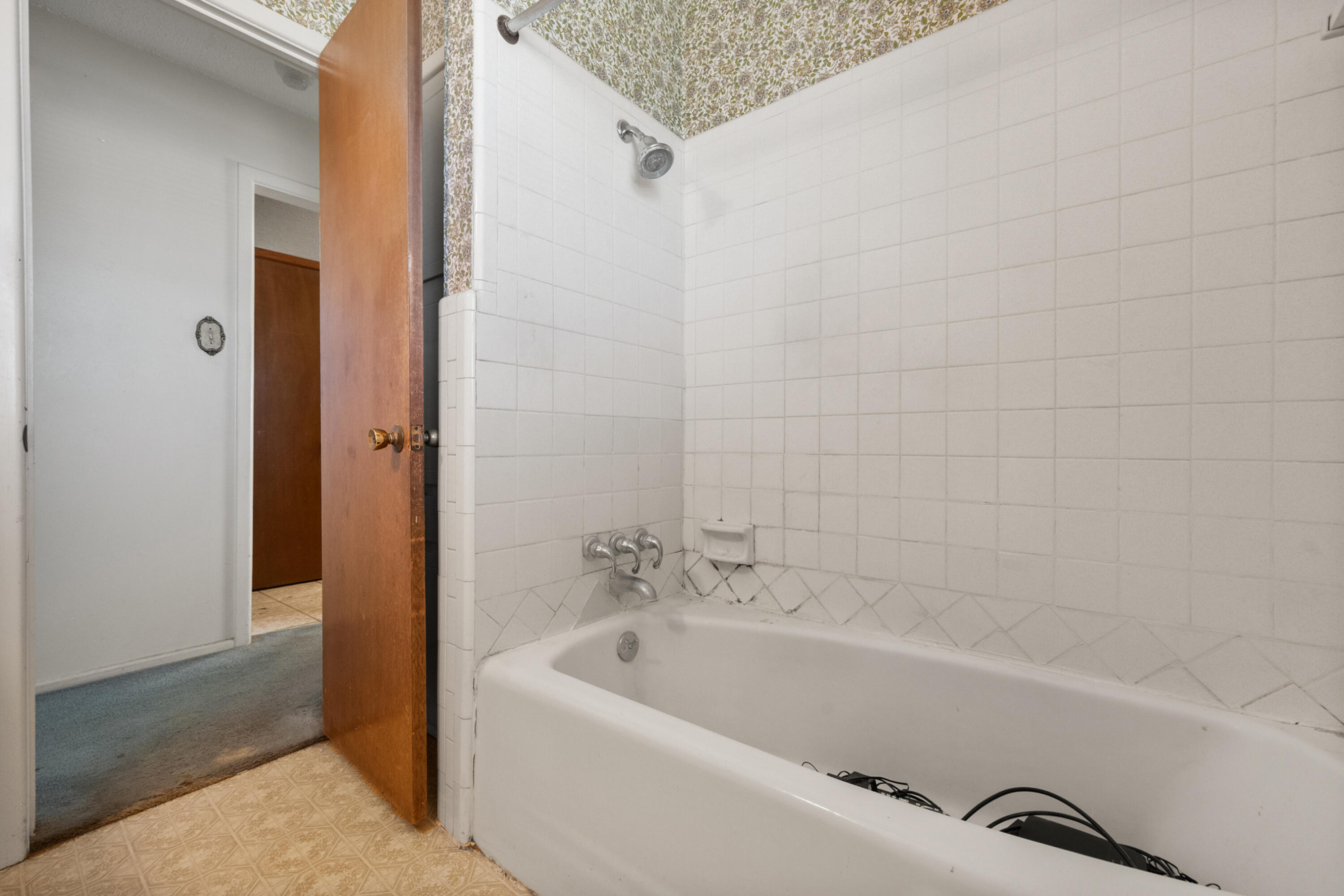5440 48th Street Lubbock, TX 79414 - Photo 22 of 28 a white bath tub sitting next to a white sink