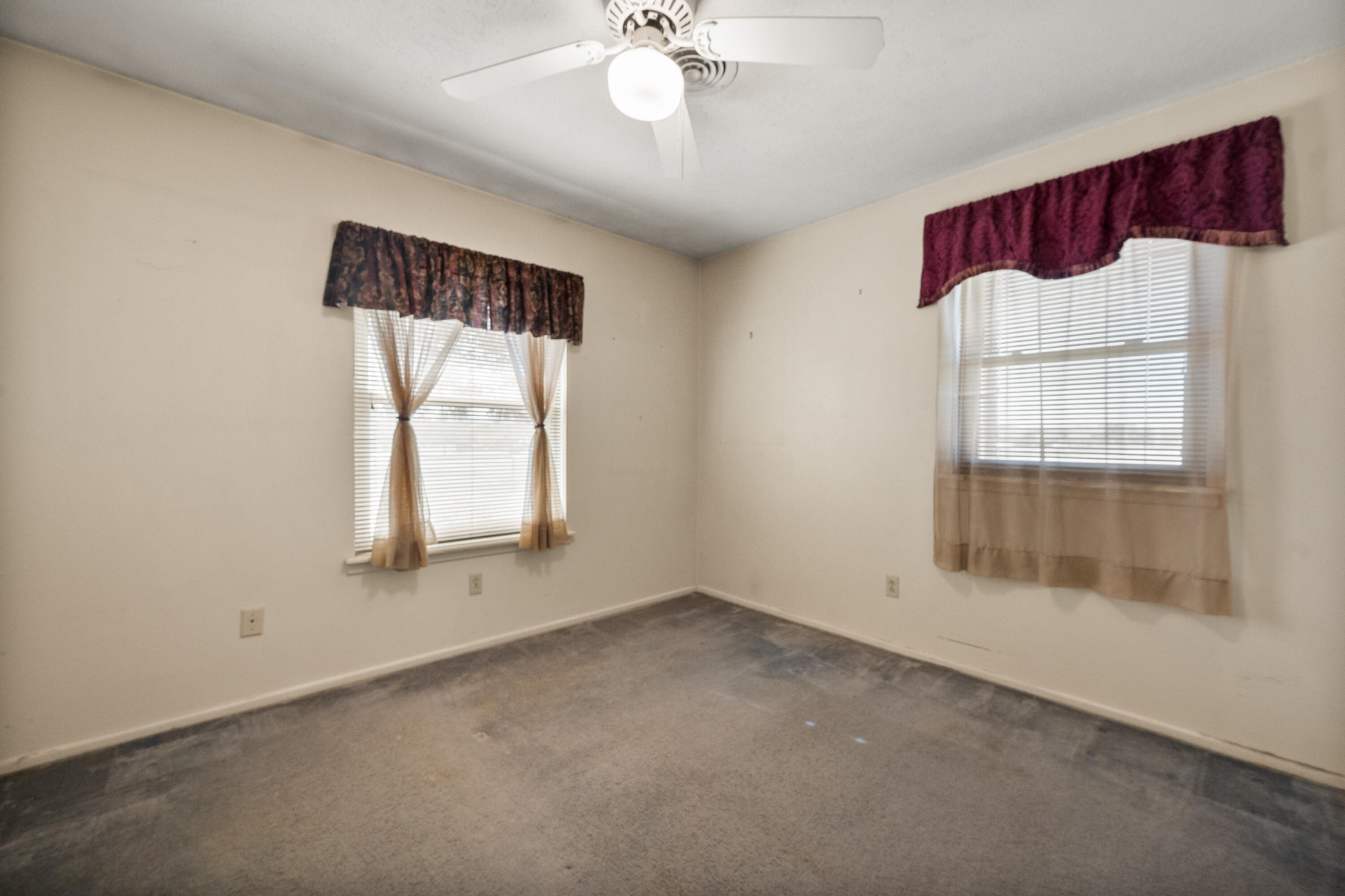 5440 48th Street Lubbock, TX 79414 - Photo 23 of 28 wooden floor in an empty room with a window