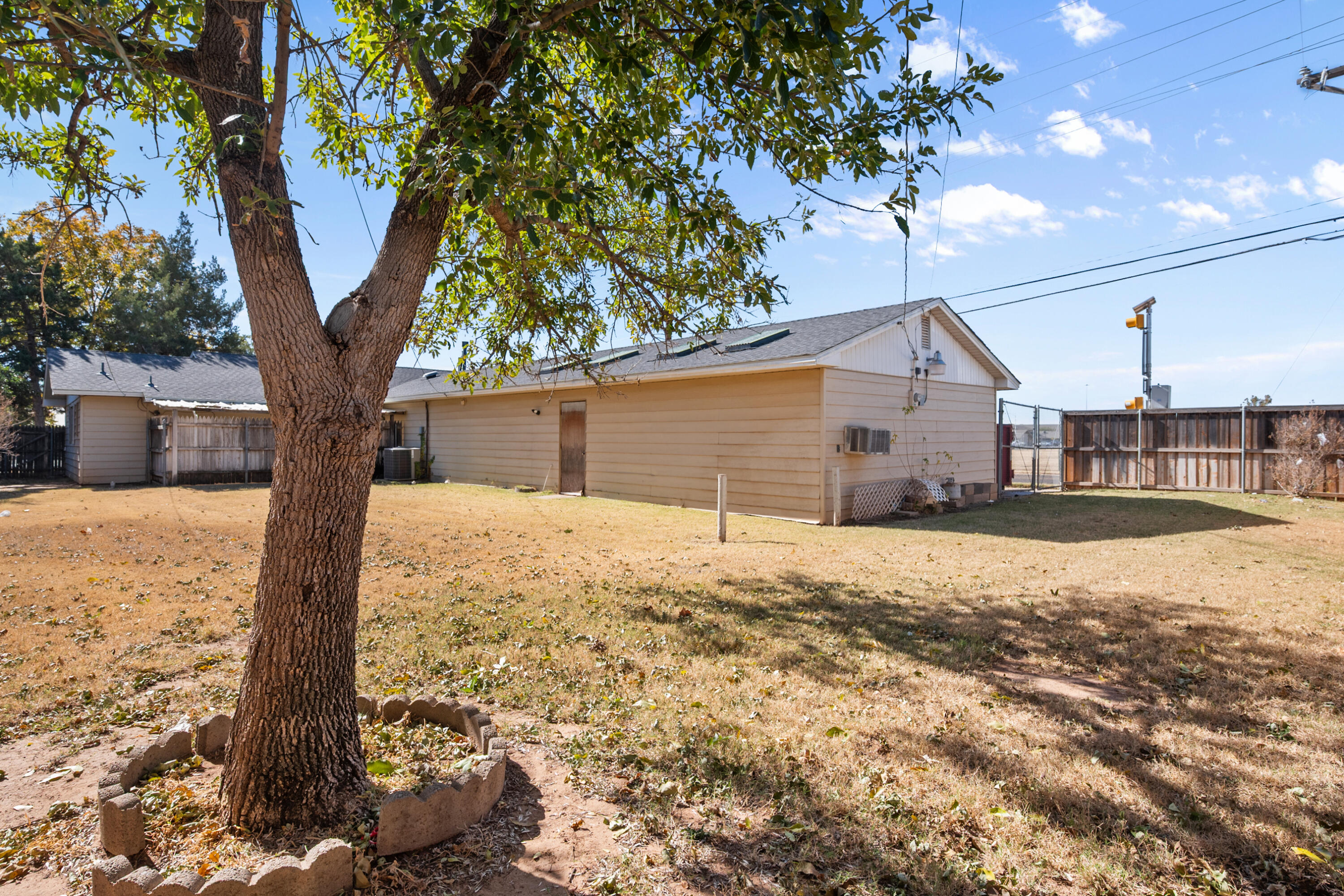 5440 48th Street Lubbock, TX 79414 - Photo 24 of 28 a front view of a house with a yard